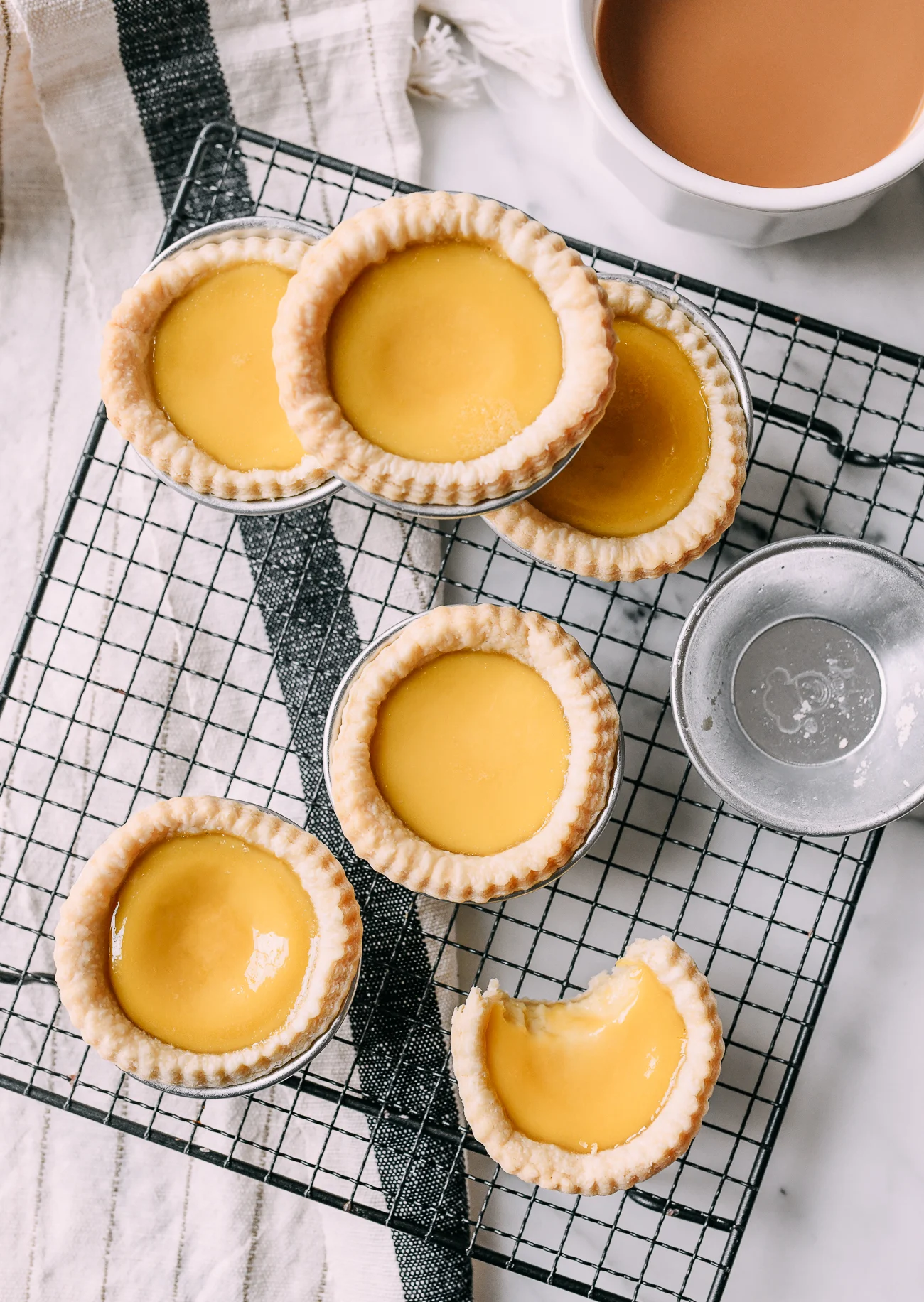 Freshly baked Hong Kong egg tarts with glossy custard filling